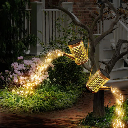 SOLAR POWERED DECORATIVE WATERING CAN WITH CASCADING LIGHT